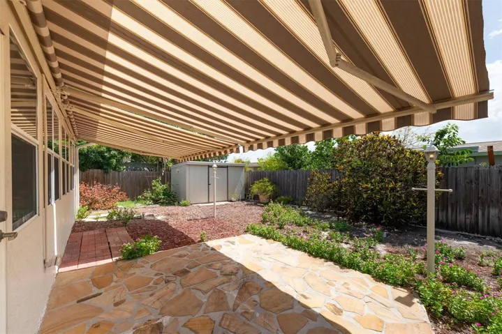 Back Stone Patio with remote controlled Sun Shade Awnings