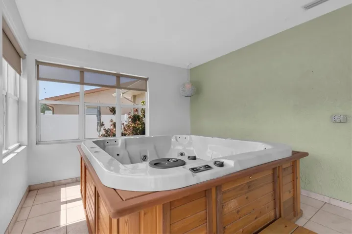 Amazing spa area featuring a relaxing retreat for your enjoyment. Perfect for unwinding after a long day, this space offers ultimate tranquility and comfort.