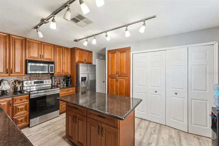 Kitchen with laundry closet on the right
