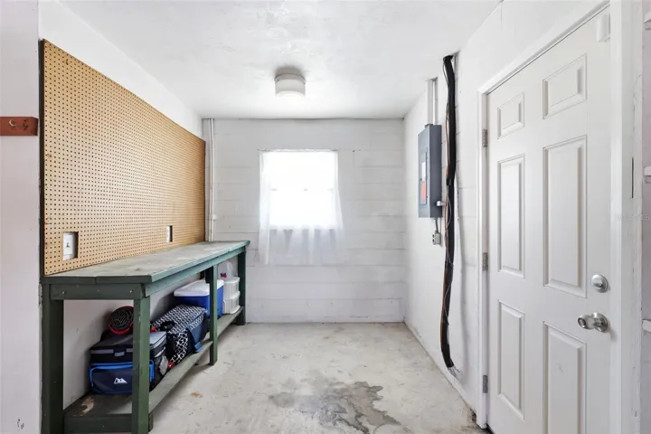 Tandem storage space in garage. Bench stays! Yes, that electrical panel is updated.