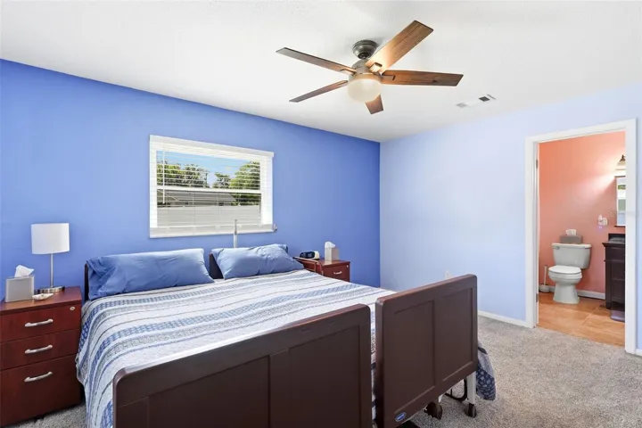 Primary bedroom w/remodeled ensuite bath.