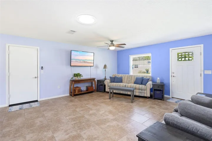 Main living area. Garage door on left, front door on right. The solar tube provides an abundance of natural lighting.