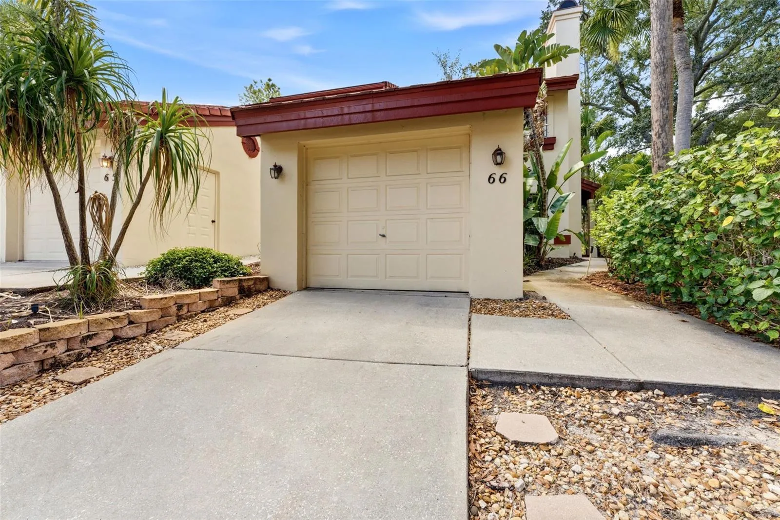 Garage entrance sidewalk on the right to the front door