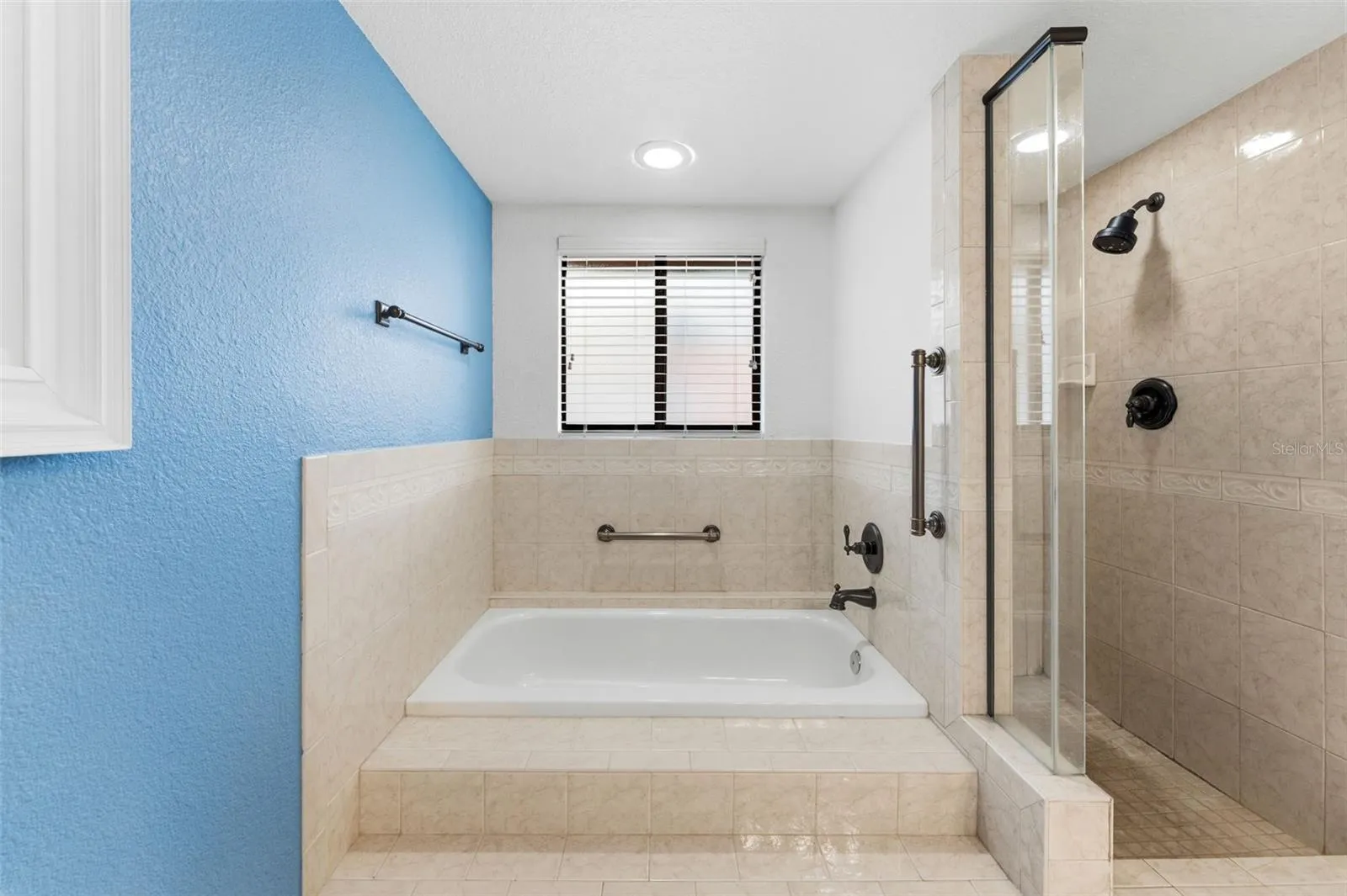 Ensuite in primary tub and separate shower