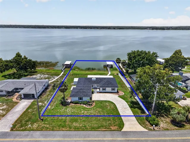 Aerial Front Elevation with Property Lines and INCREDIBLE WATERFRONT VIEWS of Lake Griffin!