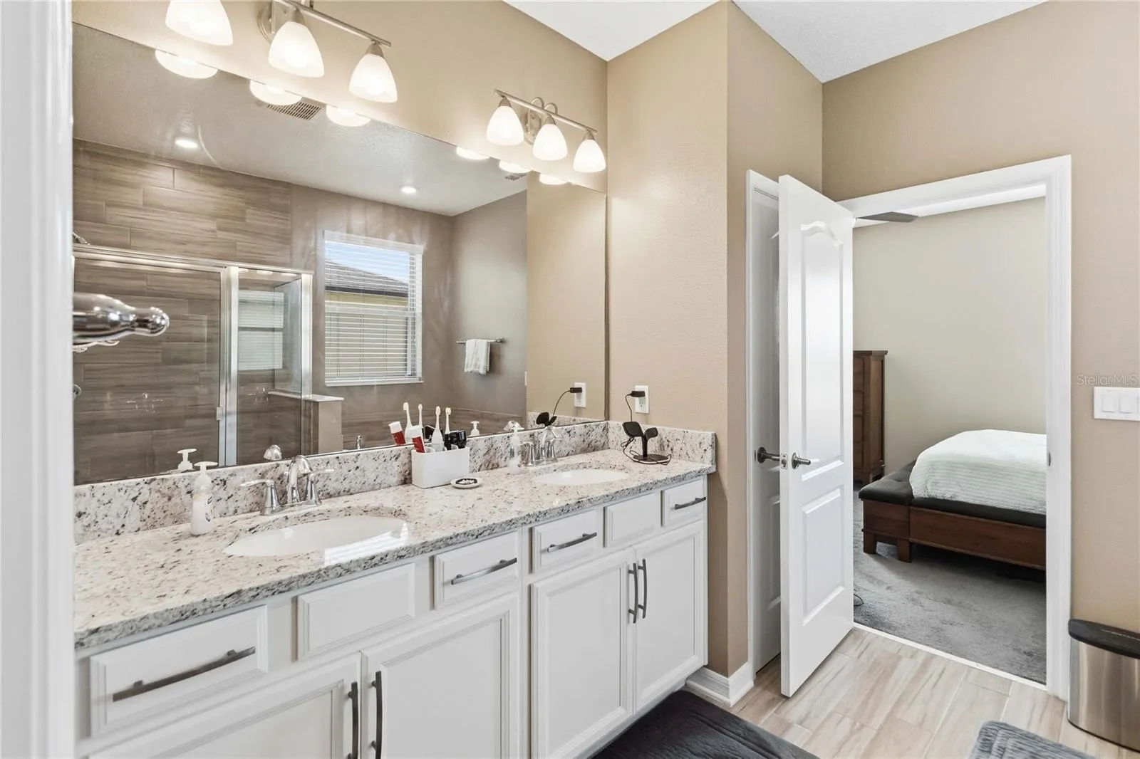 Primary bath with dual-sink vanity and ample storage