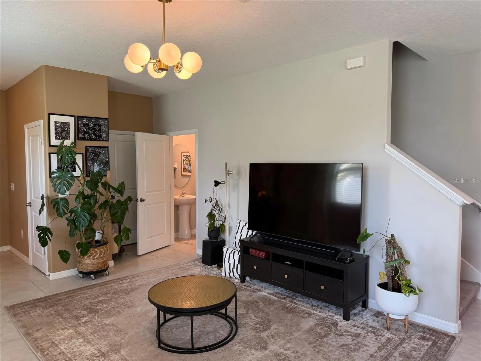 Livingroomw with half bath and garage access