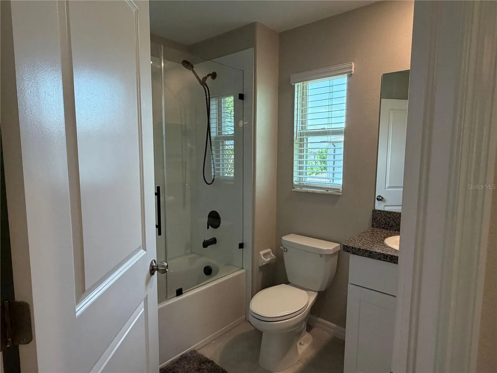 Secondary Bedroom with walk in closet and private ensuite.