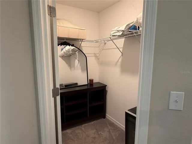 Secondary Bedroom with walk in closet and private ensuite.