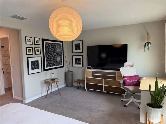 Primary Bedroom with walk in closet and private ensuite.