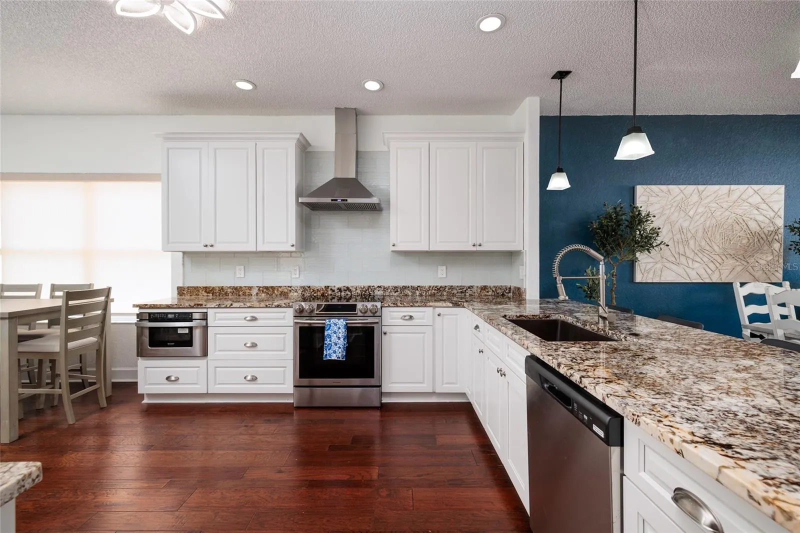 Kitchen with stainless steel appliances, and an eat in kitchen area.