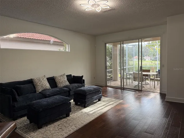Freshly painted living room with sliders to lanai