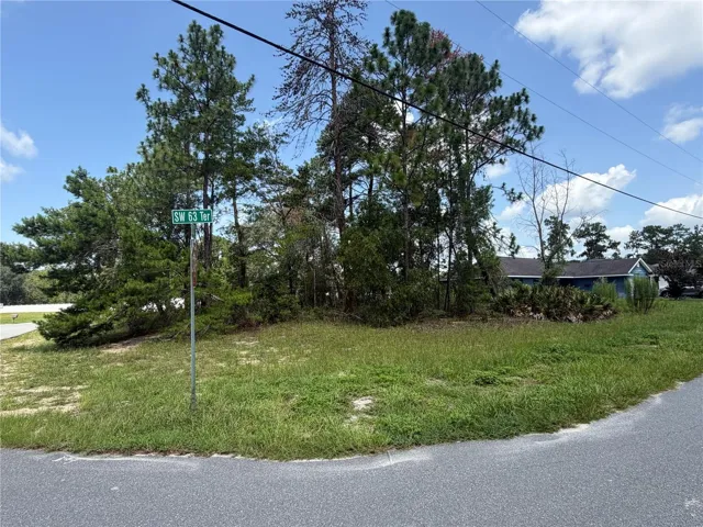 CORNER OF LOT AT STOP SIGN