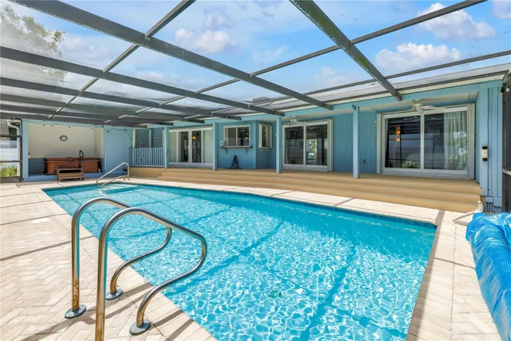 Rear view of pool & home