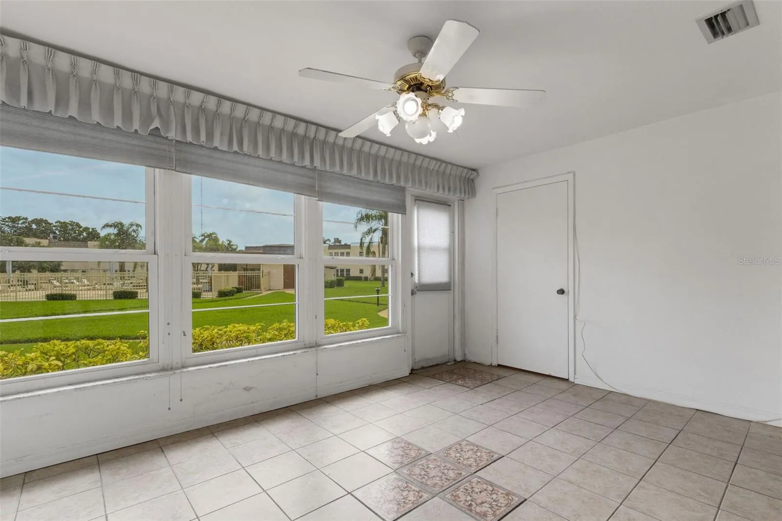 Florida Room. The Door on Right is a Storage Closet.