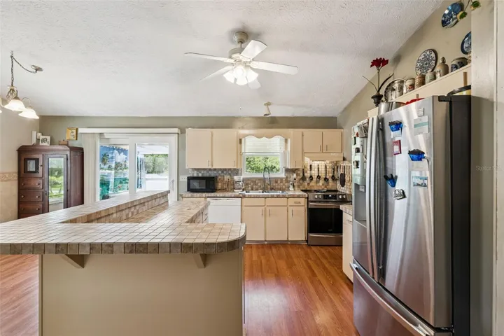 View of kitchen and entry to deck