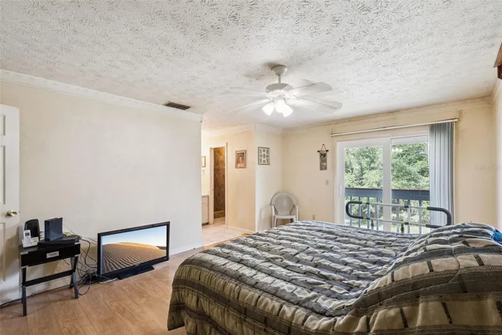 View of primary bedroom and deck