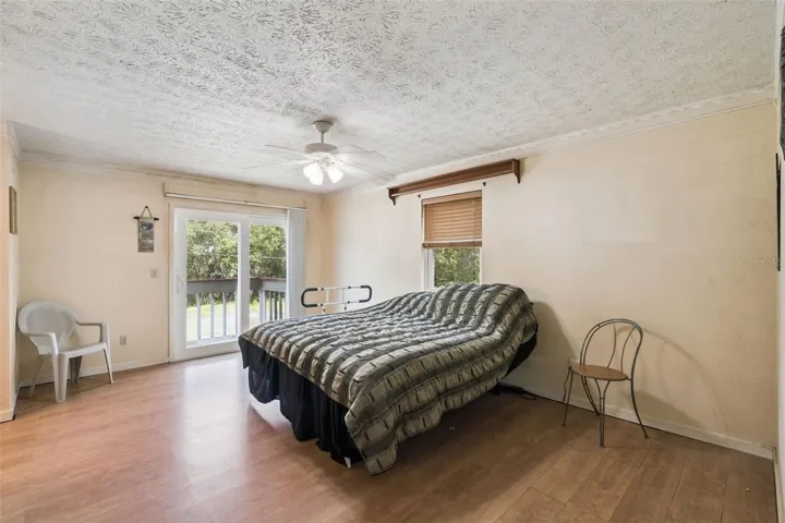 View of primary bedroom and deck