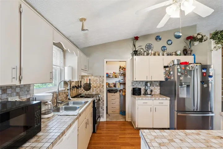 View of kitchen and walk in pantry