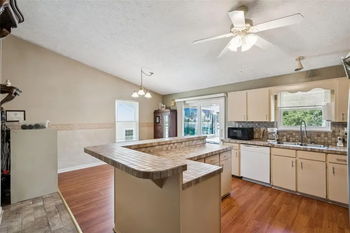 View of kitchen and entry to deck