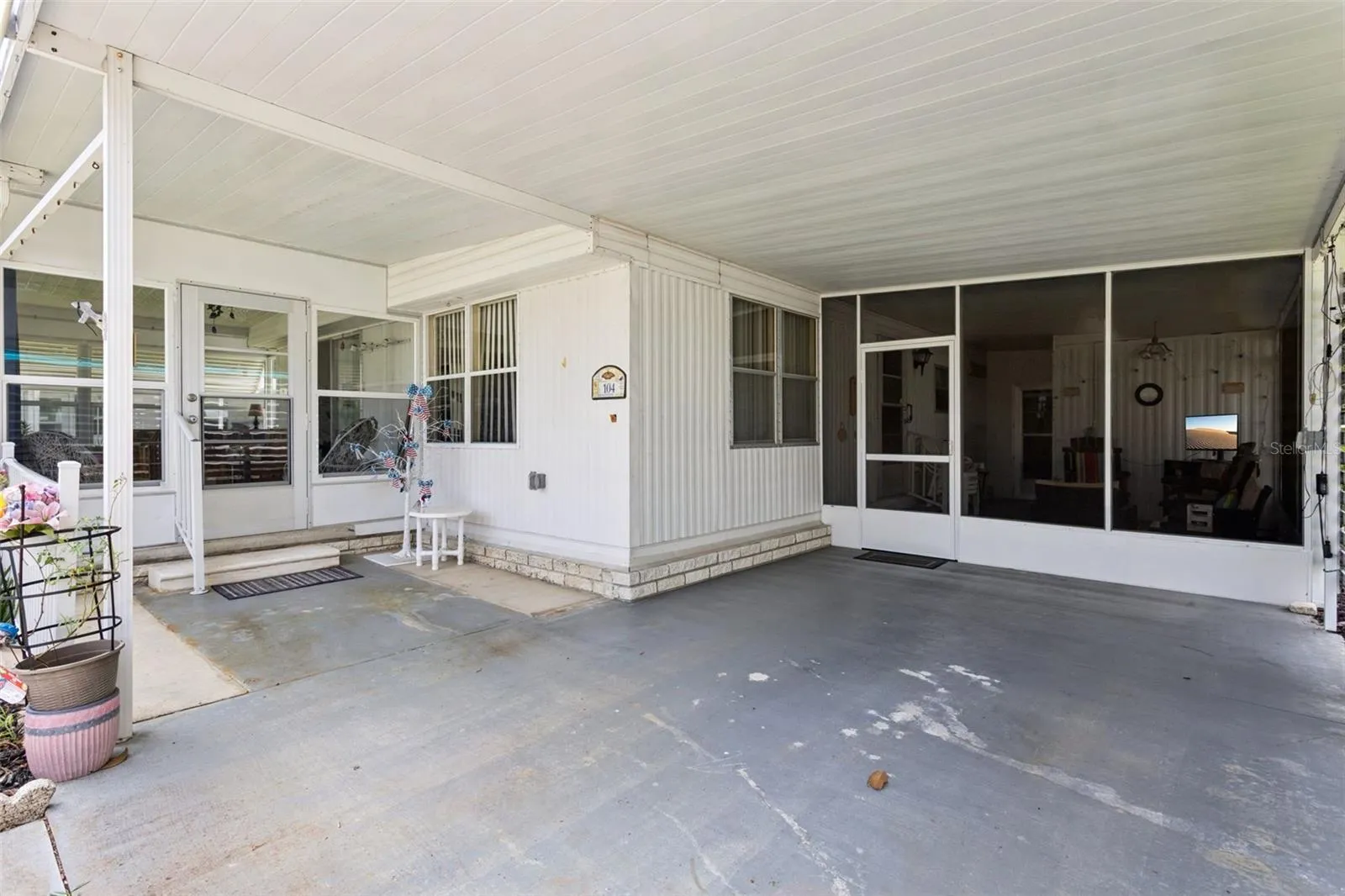 THE SPACIOUS CARPORT HAS ROOM ENOUGH FOR AN AUTO PLUS A GOLF CART.