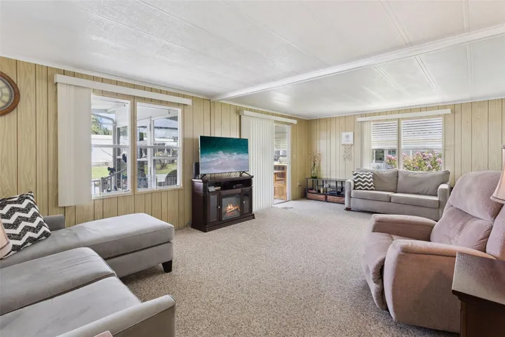 THE LIVING ROOM HAS A COZY FREE-STANDING FIREPLACE TO STAY COZY ON A CHILLY WINTER NIGHT.