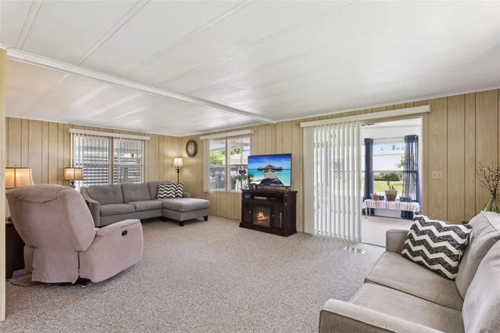 THE SPACIOUS LIVING ROOM HAS LOTS OF NATURAL LIGHT!