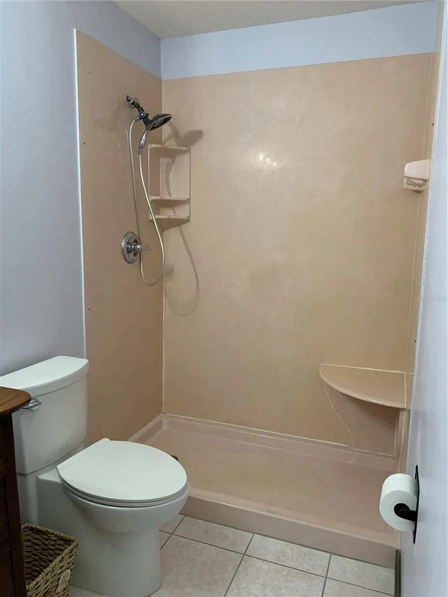 Step in shower, easy clean, just hang shower curtain