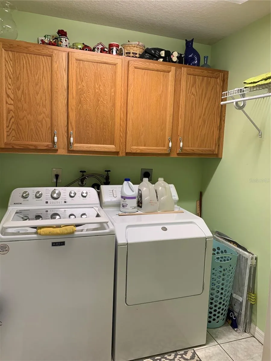Bonus!! Indoor laundry room with storage and hanging drying rack!  Not missing a thing!