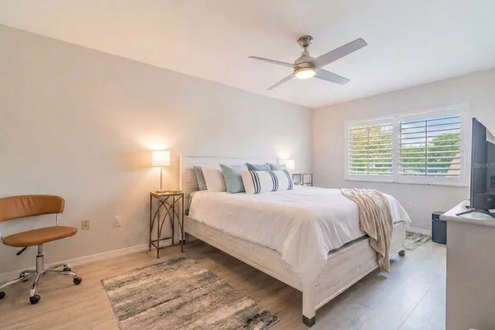 Primary bedroom with plantation shutters