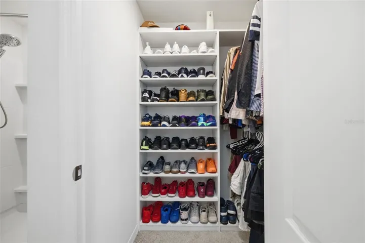 Primary Custom Built Closet (His)