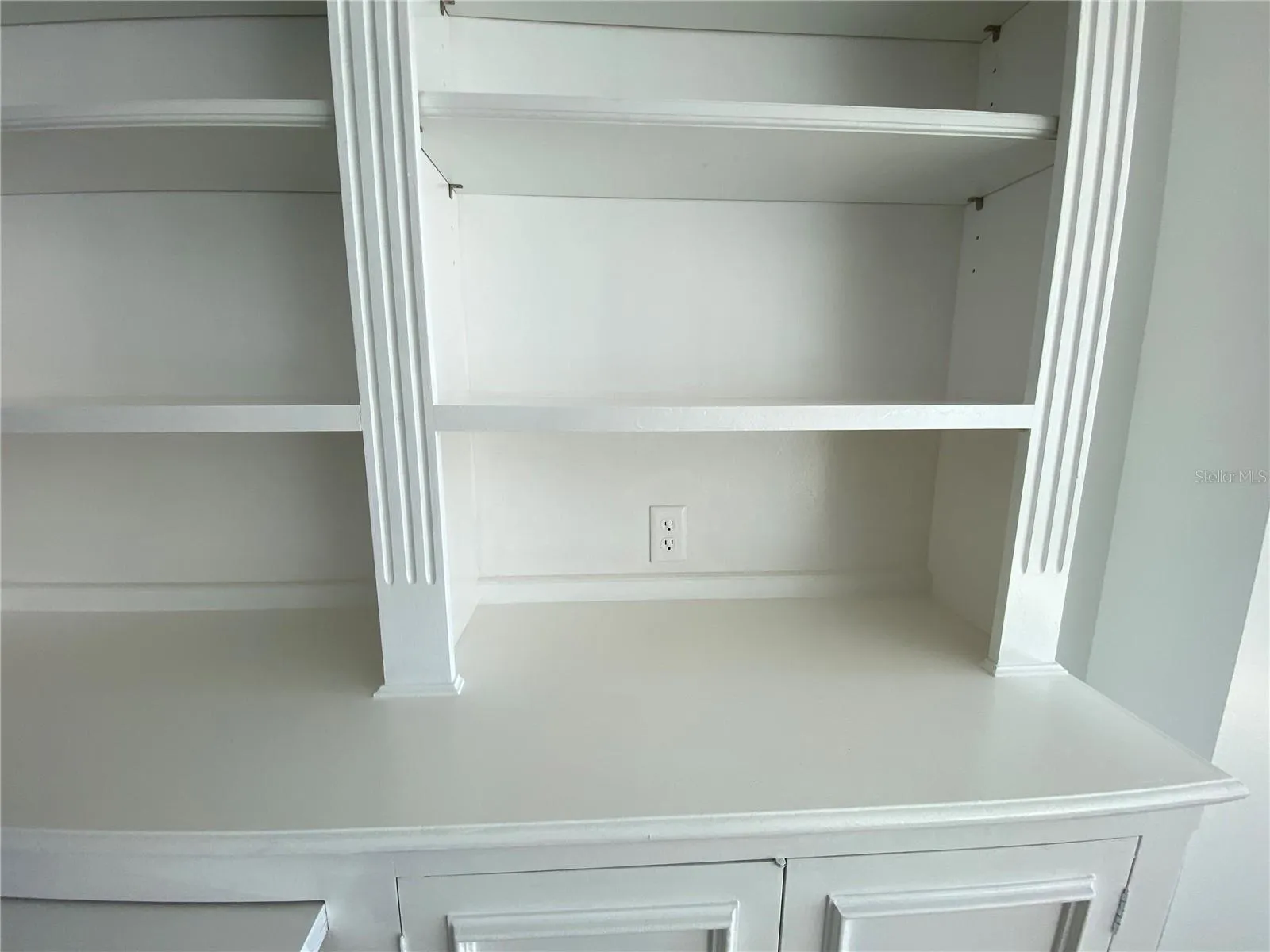 an outlet in the bookcase