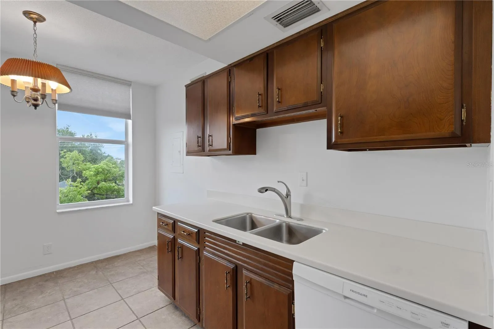 Kitchen with wood cabinets