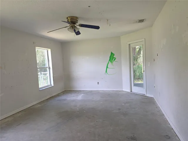 Primary Bedroom with lanai entry door