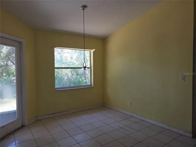 Breakfast nook with lanai entry door