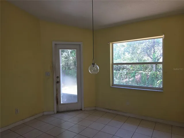 Breakfast nook with lanai entry door