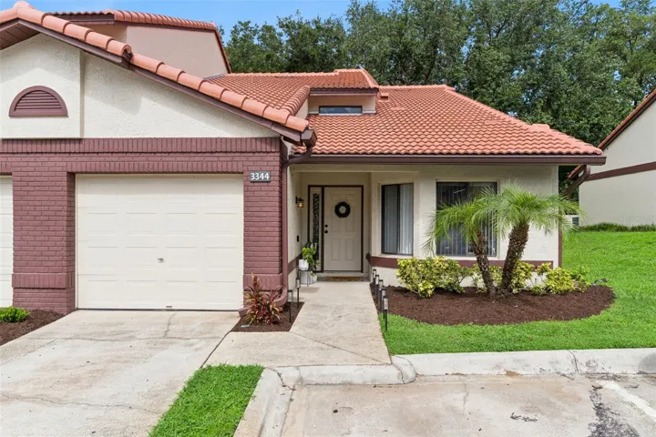 Beautiful Mediterranean-style condo with an attached garage, mature landscaping, and low-maintenance living in the desirable Foxwood community of Apopka. Completely move-in ready with beautifully updated interiors.