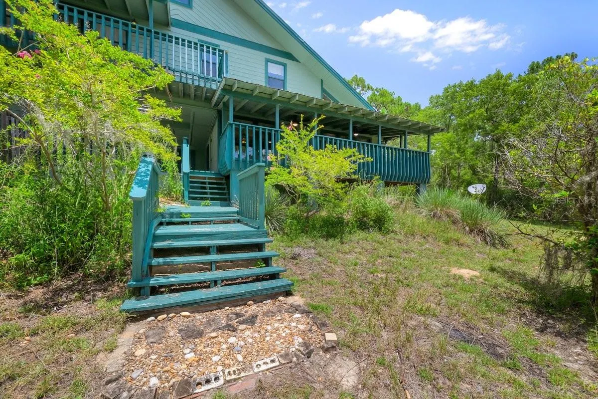 back Steps leads to breezeway, back deck and outside shower