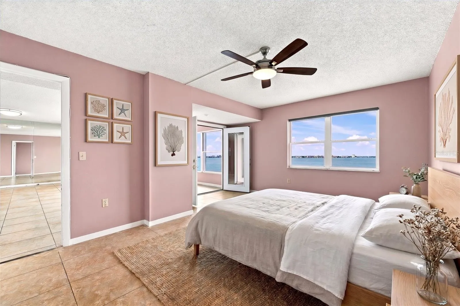 Primary bedroom with water views.