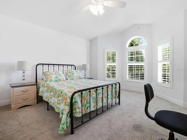 Guest bedroom with beautiful bay window and vaulted ceilings