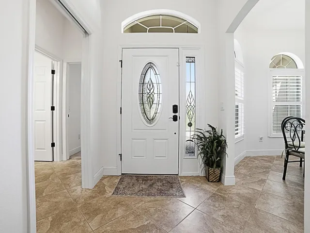 Impressive entry with side light panel and eyebrow window