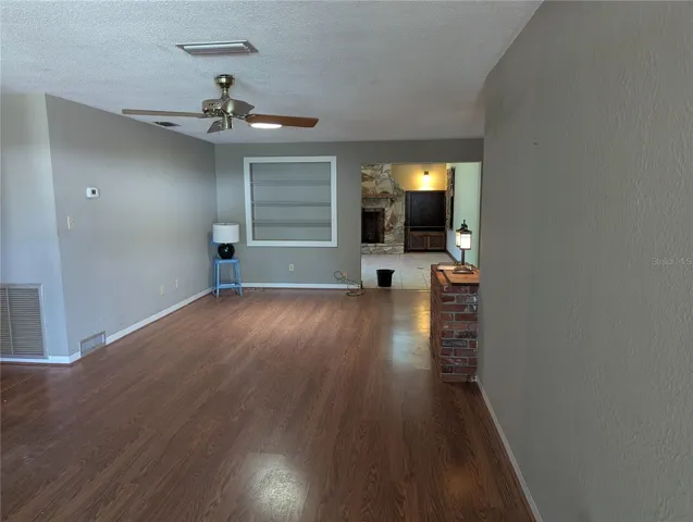 LIVING ROOM WITH OPENING TO FAMILY ROOM