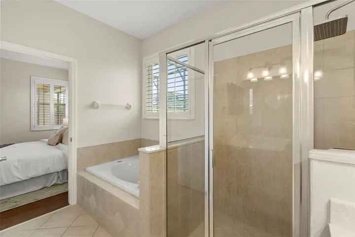 The spacious primary ensuite offers dual vanities, abundant cabinet and counter space, a relaxing soaking tub, and a separate walk-in shower.