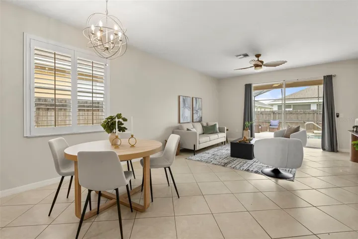 Open plan kitchen and family room with eat in nook and breakfast bar seating.