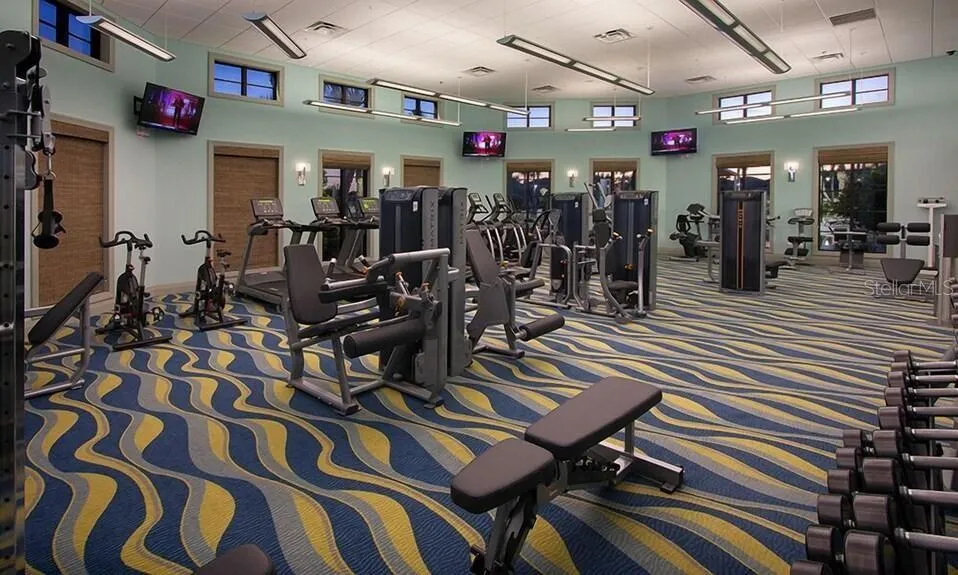 Resort-style living at ChampionsGate! Enjoy incredible community amenities including resort pools, a lazy river, water slides, splash areas, clubhouse, fitness center, dining, sports courts and more—all designed to make every day feel like a vacation.