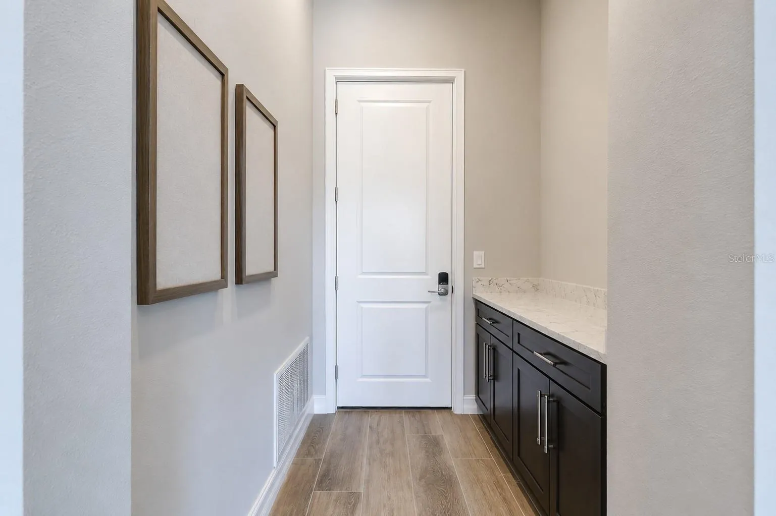 Entry to Garage with Cabinets/Storage