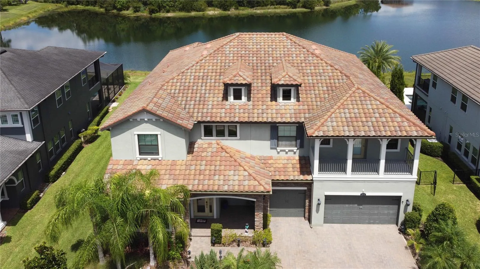 Aerial showing beautiful tile roof, pond in the back