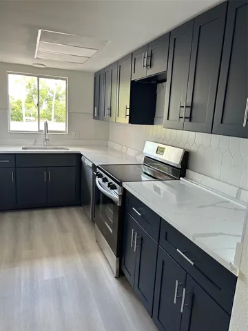 Lovely kitchen w/ window for natural light. All new appliances, countertops, flooring.