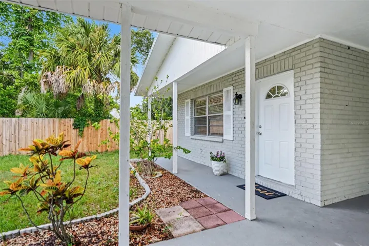 A welcoming covered entry offers the perfect spot to greet guests.