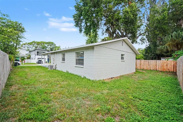 A generous backyard offers plenty of room to relax, entertain, garden, or play.